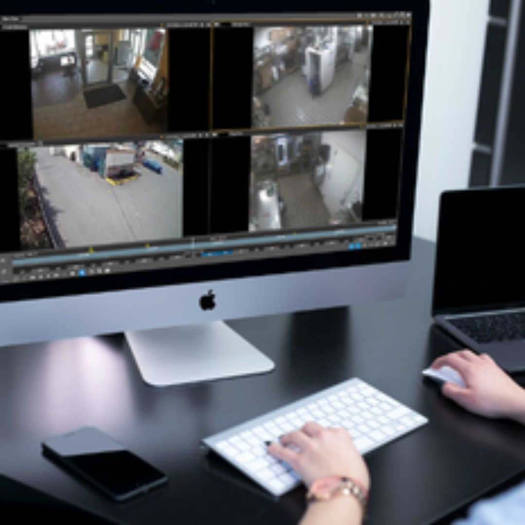 Woman viewing QSR video footage on her computer.
